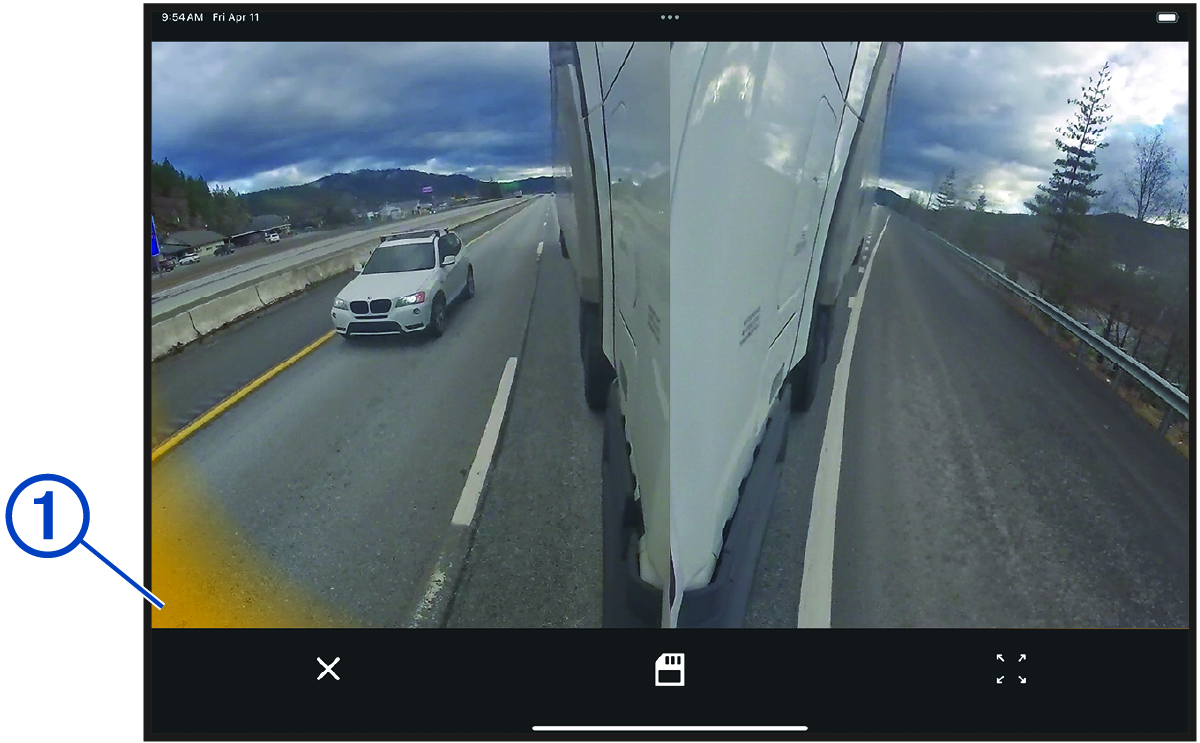 Camera view showing a blind spot alert with a callout