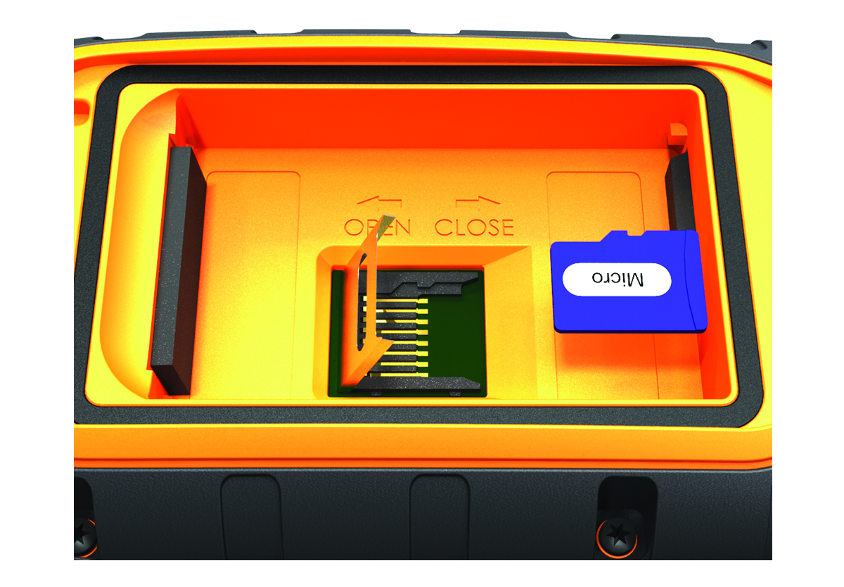 Close-up view of the memory card being installed in the device